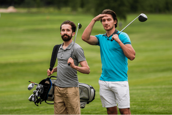 Front-view-adult-friends-playing-golf Front view adult friends playing golf